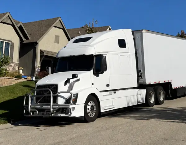 Moving truck parked outside a home ready for a state-to-state move