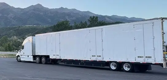 Long-distance moving trailer on a highway